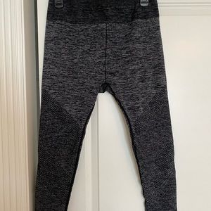 Black and gray striped compression leggings